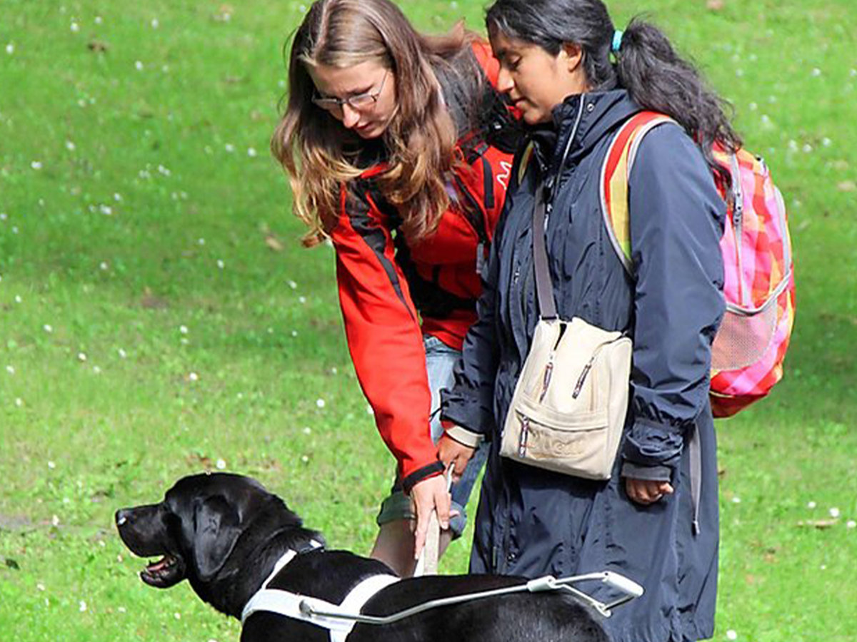 Aurélie and guide dog Nalu during the training in Bruges, Belgium 
